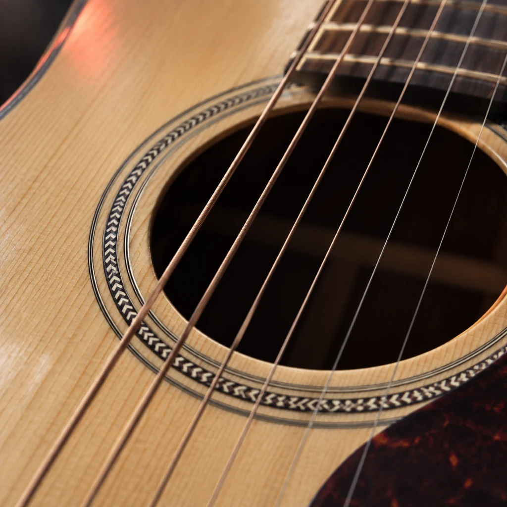 Close-up of spruce top grain and rosette on an acoustic guitar